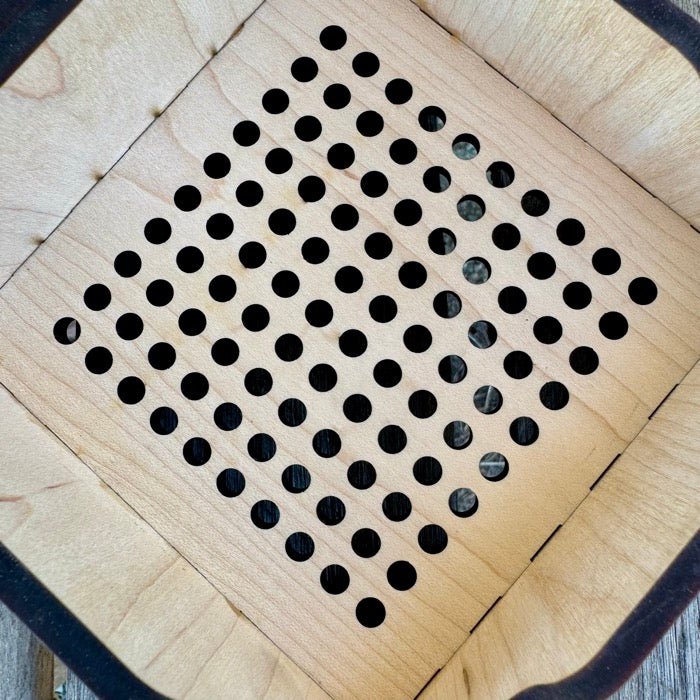 Wooden surface with black circular patterns