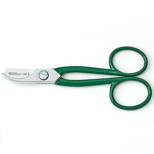 Green scissors with silver blades on a white background